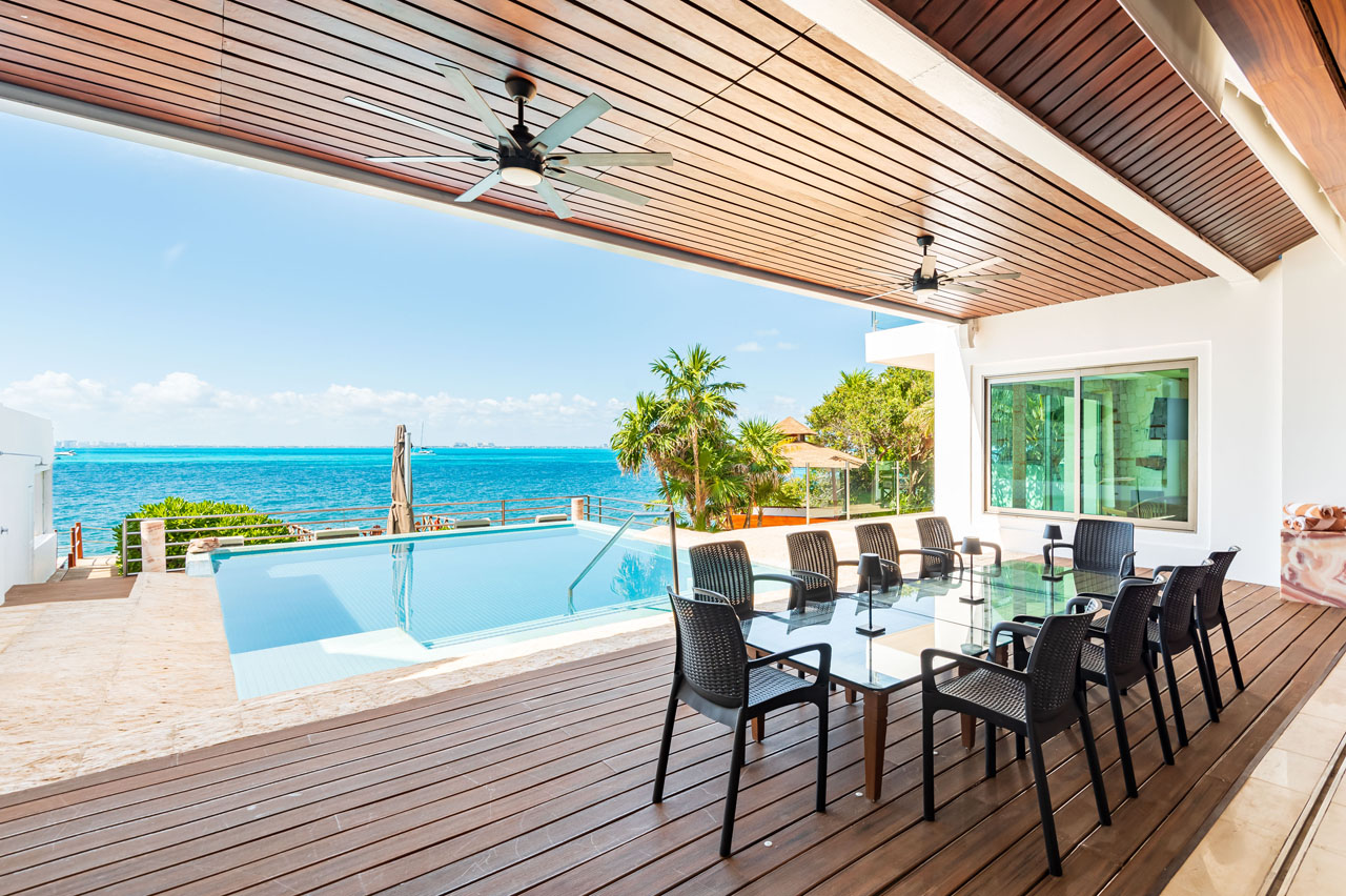Heated infinity pool overlooking the Caribbean Sea at Villa Delfines Isla Mujeres