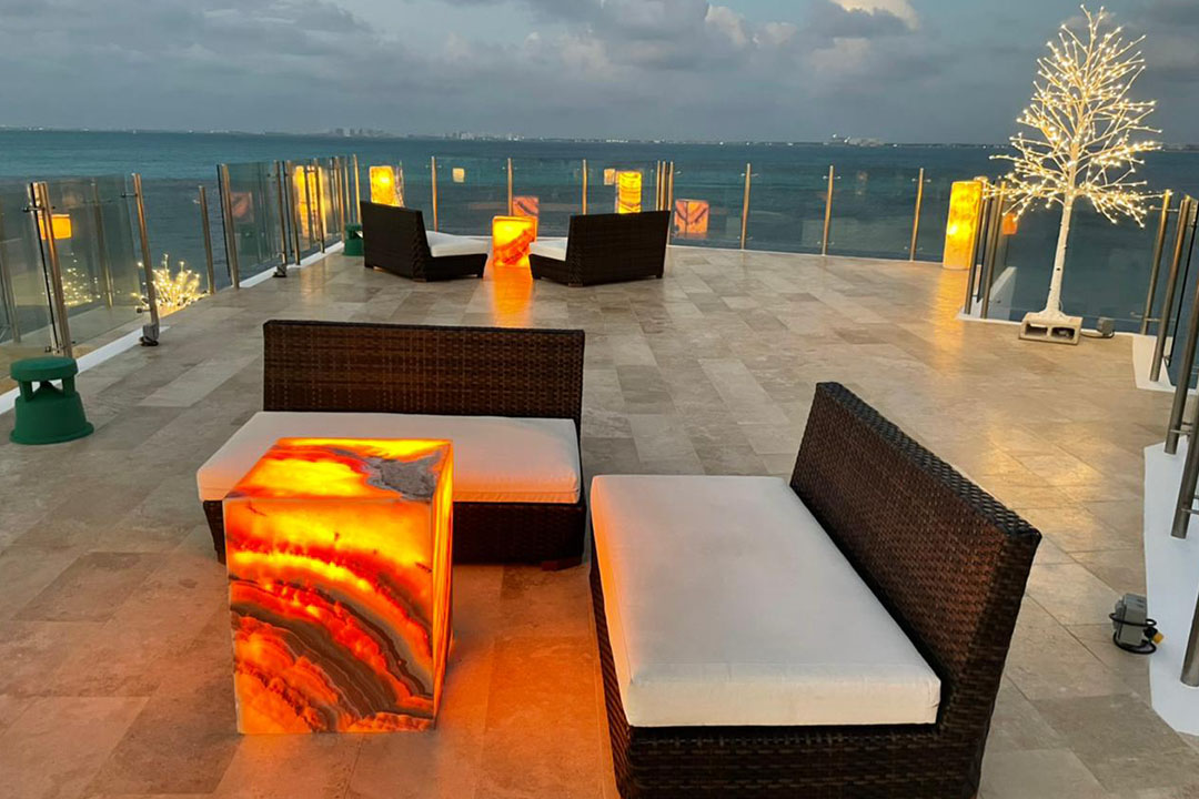 Villa Delfines oceanfront exterior at sunset in Isla Mujeres